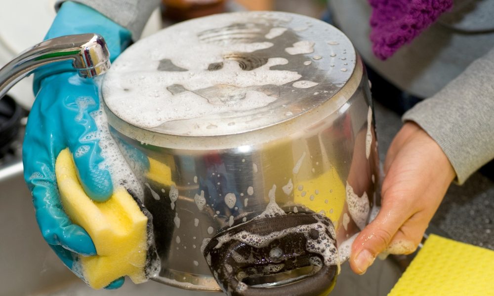 Soaking The Pot In Warm Water & Dish Soap